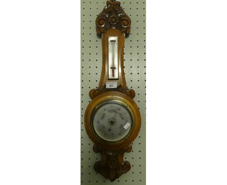 Late 19th/early 20th Century carved oak barometer/thermometer combination