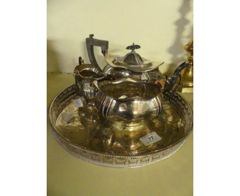 A 20th Century silver-plated three piece tea service with accompanying circular tray.