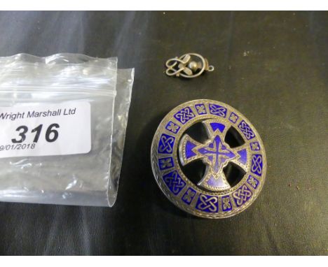 A Scottish white metal and blue enamel brooch, and a hardstone set thistle pendant (2)