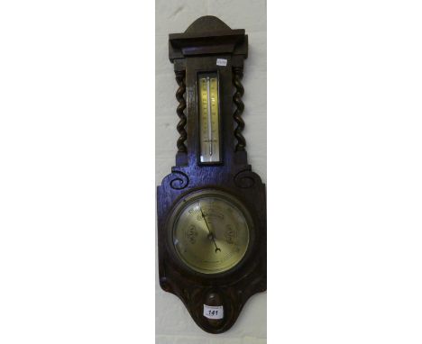 A small early 20th Century wall mounted barometer/thermometer combination in oak case with barley twist supports.