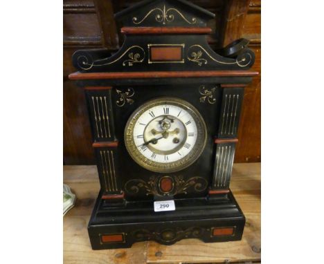 A Victorian black slate and marble mantel clock of architectural form.