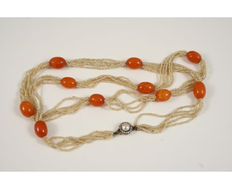 A SEED PEARL AND AMBER SET NECKLACE formed with five strands of small seed pearls, mounted with oval amber beads to a rose-cu