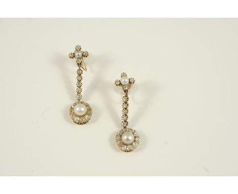 A PAIR OF DIAMOND AND PEARL DROP EARRINGS each set with a cluster, centred with an untested pearl within a surround of cushio