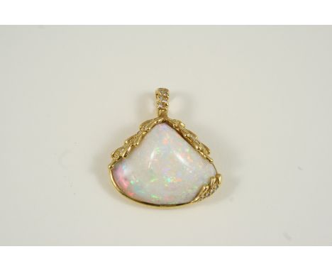 AN OPAL AND DIAMOND PENDANT mounted with a solid white opal cabochon within an 18ct. gold triangular-shaped surround, set wit