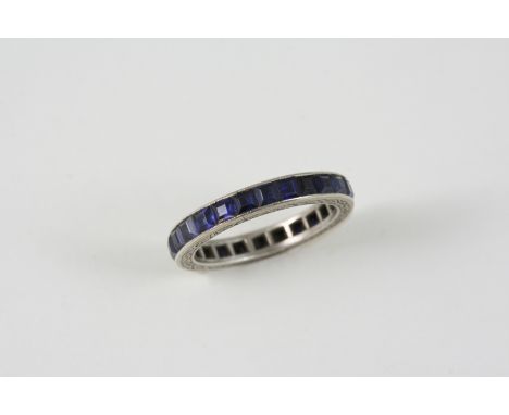 A SAPPHIRE FULL CIRCLE ETERNITY RING set with square-shaped sapphires. Size N.