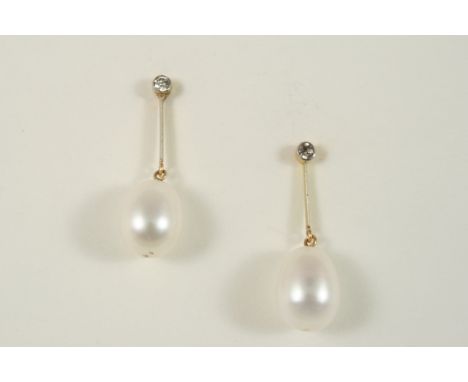 A PAIR OF CULTURED PEARL AND DIAMOND DROP EARRINGS each earring with a cultured pearl drop suspended from a gold knife edge s