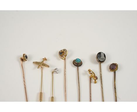 EIGHT ASSORTED GOLD AND GEM SET STICK PINS