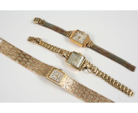 A LADY'S 9CT. GOLD WRISTWATCH BY AVIA the signed square-shaped dial with baton numerals, on a two colour gold textured integr