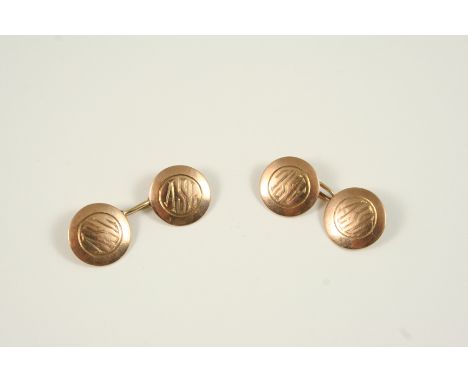 A PAIR OF 9CT. GOLD CUFFLINKS of circular form, each link engraved with the initials A.S.L., 6.6 grams. With box.