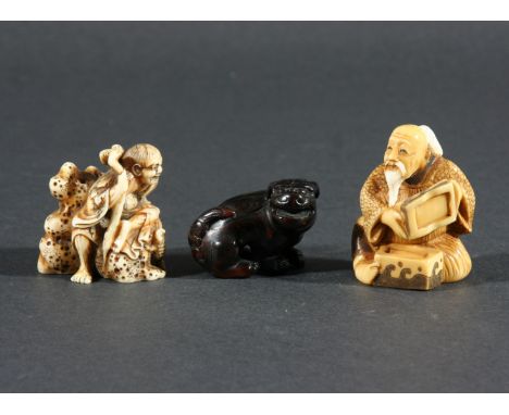JAPANESE IVORY NETSUKE, carved as a figure seated on a rock with a three legged toad, signed, width 3.5cm; together with anot