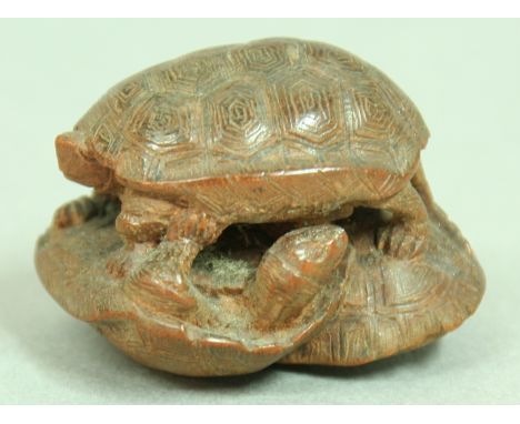 JAPANESE WOODEN NETSUKE OF THREE TORTOISES, signed, length 3.5cm; together with another of a sleeping Shojo, and another (3)