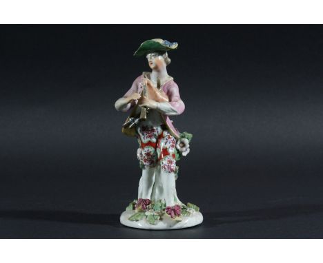 DERBY FIGURE OF A PIPER, late 18th century, standing on a flower encrusted base, patch marks, height 16cm