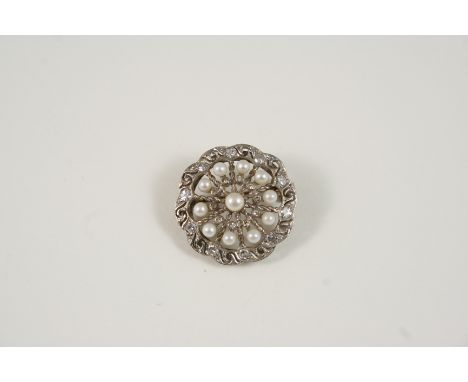 A DIAMOND AND PEARL SET BROOCH of flowerhead form, set overall with single-cut diamonds and untested pearls, 2.5cm. dia.