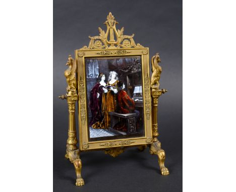 LIMOGES ENAMEL TABLE MIRROR - WAGNER a decorative brass easel with a framed enamel plaque on one side, depicting an organist 