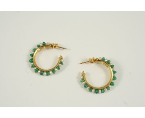 A PAIR OF EMERALD AND CULTURED PEARL HOOP EARRINGS each set with alternate emerald beads and small pearls in 18ct. gold, 2.5c