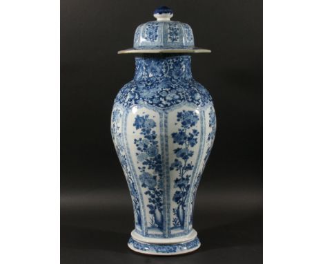 CHINESE VASE AND COVER, Qing Dynasty and probably Kangxi period, of octagonal baluster form, blue painted with ogee floral pa