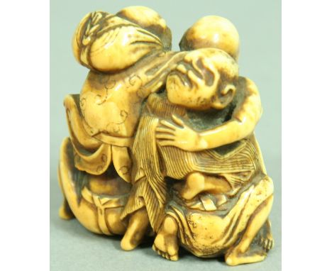 JAPANESE IVORY NETSUKE OF A MELEE OF MEN, all climbing over each other, height 4cm