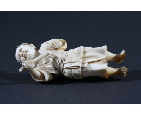JAPANESE IVORY OKIMONO, carved as a boy standing holding as staff, height 11cm, together with a Japanese netsuke carved as a 