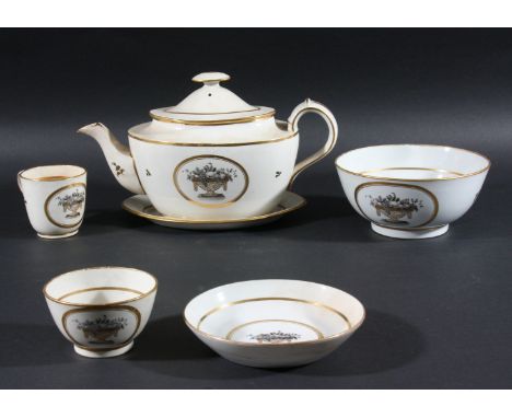 ENGLISH PORCELAIN PART TEA SET, early 19th century, pattern N. 91, of fruit en grisaille in a gilt basket, comprising teapot,