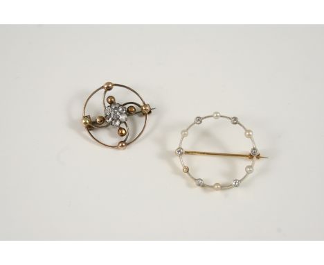 A DIAMOND AND GOLD BROOCH centred with a cluster of old brilliant-cut diamonds, 2.25cm. dia., together with a diamond, pearl 