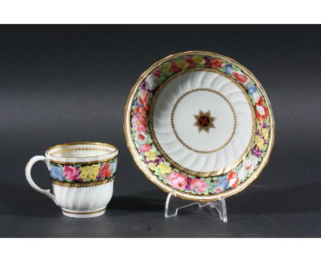 WORCESTER COFFEE CUP AND SAUCER, circa 1790, by Thomas Pardoe, the saucer with a central garter star inside a painted floral 