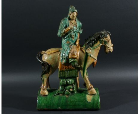 CHINESE SANCAI RIDGE TILE, modelled as a man on horseback, height 37cm, length 26cm