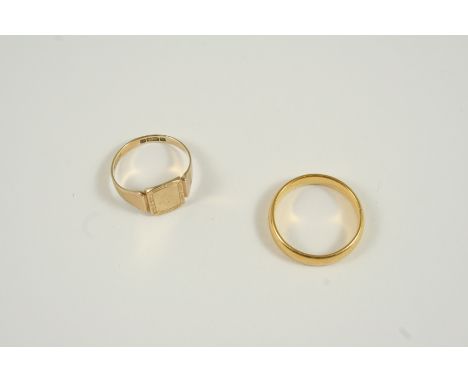 A 9CT. GOLD SIGNET RING 1.5 grams., size K, together with a 22ct. gold wedding band, 4.4 grams, size M.