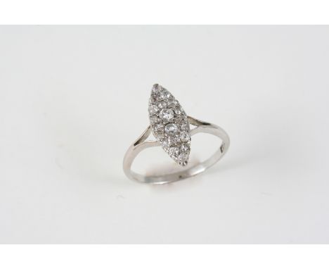 AN EDWARDIAN DIAMOND MARQUISE-SHAPED RING millegrain set with graduated old brilliant-cut diamonds, in 18ct. white gold. Size