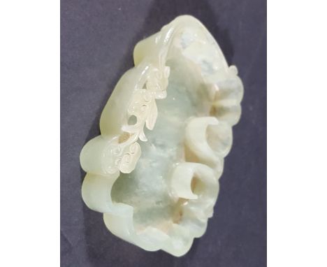 CHINESE CELADON JADE BRUSH WASHER, of scrolling outline with a dragon and floral spray to the rim, 11cm x 8cm