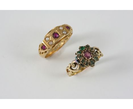 A VICTORIAN 18CT. GOLD RING set with three circular-cut rubies and four half pearls, size K 1/2, together with a ruby and eme