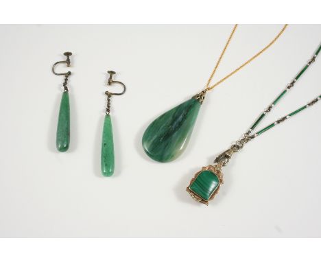 AN PEAR-SHAPED JADE PENDANT 4.5cm. long, together with a pair of jade drop earrings and a malachite and gold pendant in the f