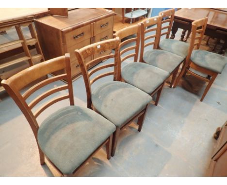 Set of six ladder back chairs with green upholstered seats