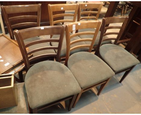 Set of six ladder back chairs with green upholstered seats