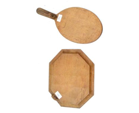 A Robert ''Mouseman'' Thompson Oak Cheese Board, with carved mouse signature on the handle, 37cm; and A Robert ''Mouseman'' T