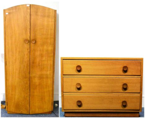 A Sid Pollard Oak Wardrobe, with arched top over two doors with circular knobs, the interior with a shelf above an oak rail, 