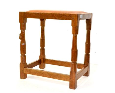 A Robert Mouseman Thompson Oak Dressing Table Stool, with tan hide seat, on four octagonal legs joined by stretchers, with ca