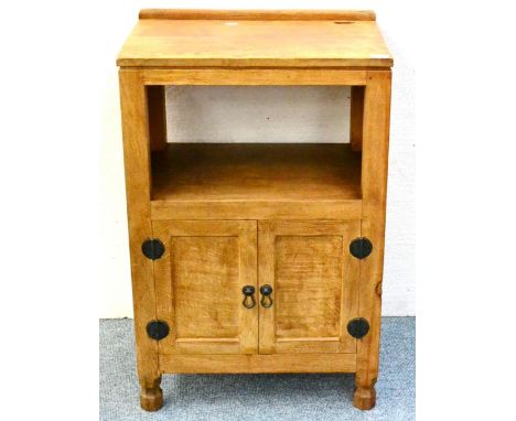 A Robert ''Mouseman'' Thompson Oak Music Cabinet, with raised upstand, above an open backed compartment, above two cupboard d