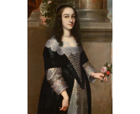 Follower of Gerrit Van Honthorst (1592-1656) Portrait of a lady, three-quarter length, wearing a black satin dress trimmed wi