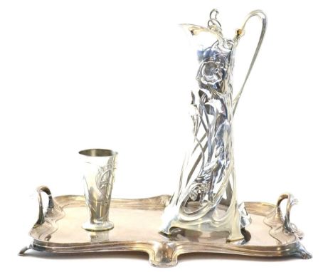 An Art Nouveau WMF Claret Jug, model No.192, with tapering  clear glass liner, the silver plated mounts cast with a maiden an