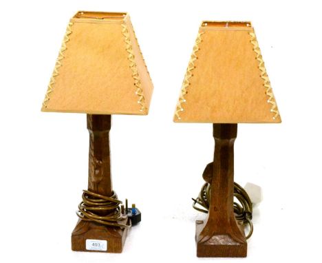A Pair of Robert ''Mouseman'' Thompson Oak Table Lamps, of octagonal form on square bases, each with carved mouse signature, 