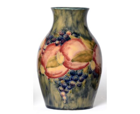 A William Moorcroft Macintyre Pomegranate Pattern Vase, dated 1912, on a mottled green ground, impressed 1434, green painted 