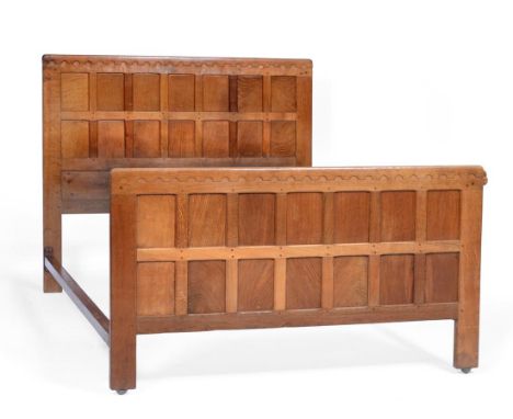 A Robert ''Mouseman'' Thompson Panelled Oak 4'6'' Bedstead, with penny moulded top, carved mouse signature on footboard, head