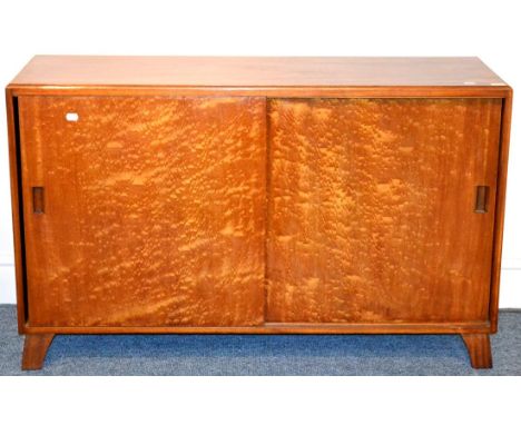 A 1940's/50's Utility Bird's Eye Maple Sideboard, the rectangular top over two sliding cupboard doors, enclosing a cutlery dr