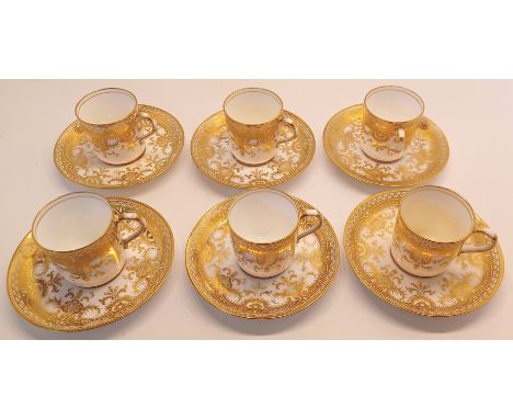 6 COFFEE CANS AND SAUCERS IN GOLD PATTERN