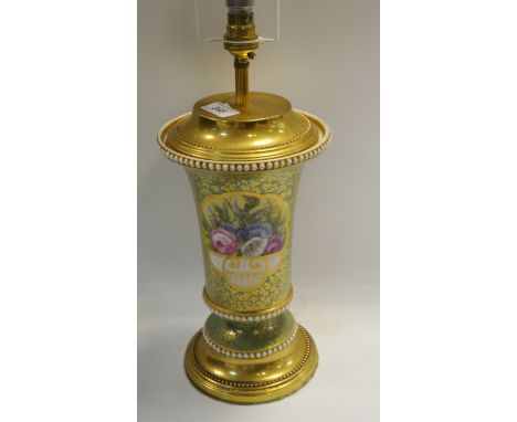 A 20th Century English porcelain flared cylindrical lamp, well painted with colourful flowers on a green ground. 
