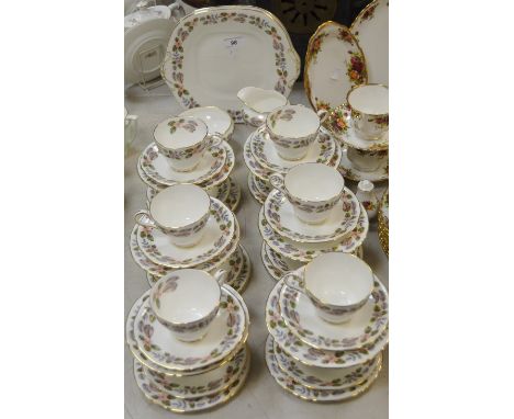 An Aynsley April Rose pattern twelve-setting tea service, comprising tea cups, saucers and tea plates, bread plate, milk jug 