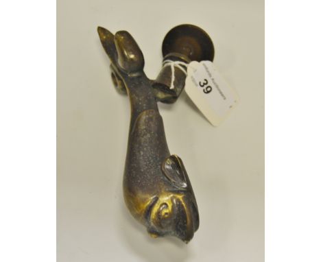 An early 20th century Maltese door knocker, as a stylized fish/dolphin, inscribed Cutajar Works, Malta, 