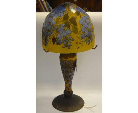 A Gallé-type cameo glass table lamp, the domed shade with wisteria in blue on a mustard ground, 58cm high