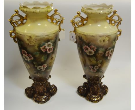 A pair of Staffordshire mantel vases printed with flowers c 1900