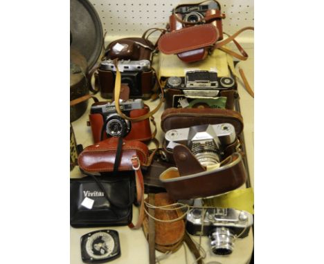 Photographic Equipment -  Voigtlander cameras; a boxed Paillard cine camera; an Halina camera; etc qty 